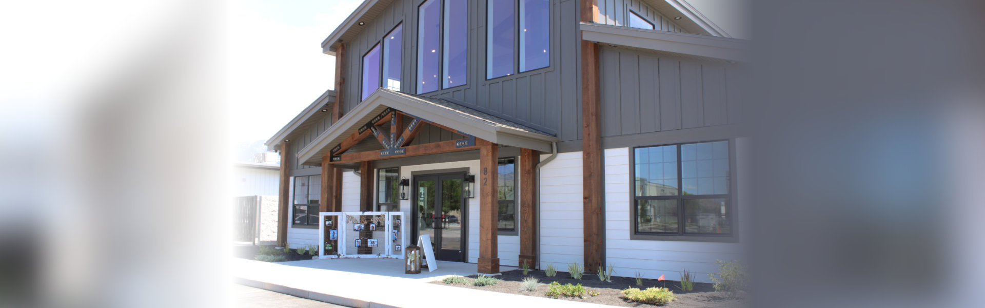 exterior of a modern, two-story commercial building on a bright, sunny day